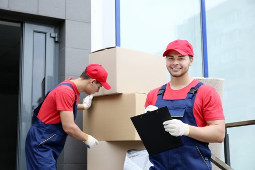 Furniture being carried safely through a flat staircase