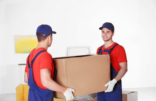 Furniture pick-up service collecting a sofa in Merton