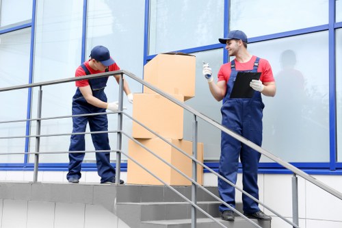 Same day removals team loading items into a van in Merton