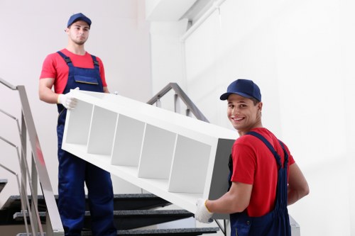Professional movers loading boxes for student removals in Merton