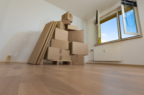 Professional movers handling furniture during a same day removal in Merton