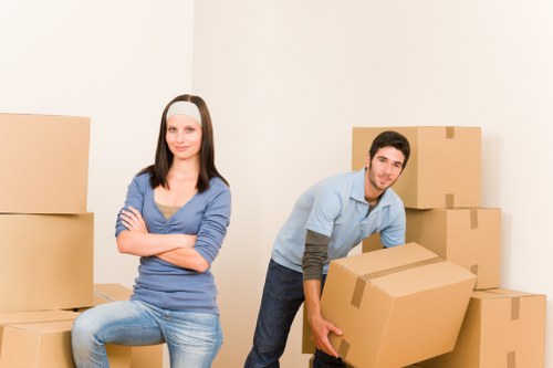 Packed moving truck with furniture and boxes for Merton relocation