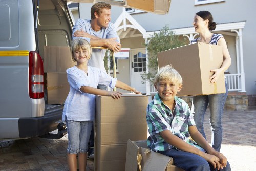 Professional movers handling furniture in Merton