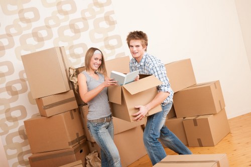 Moving crew handling furniture carefully during a local relocation