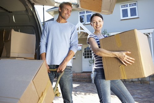 Removal professionals reviewing access details before finalising a quote