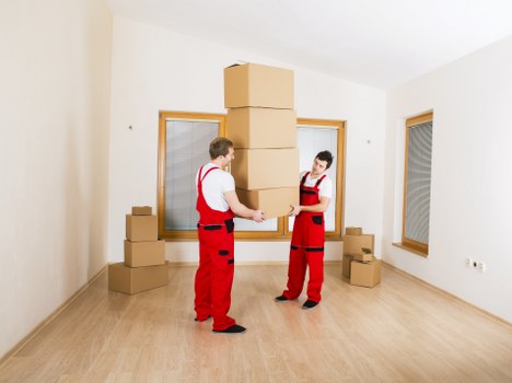 Trained movers using protective equipment during relocation