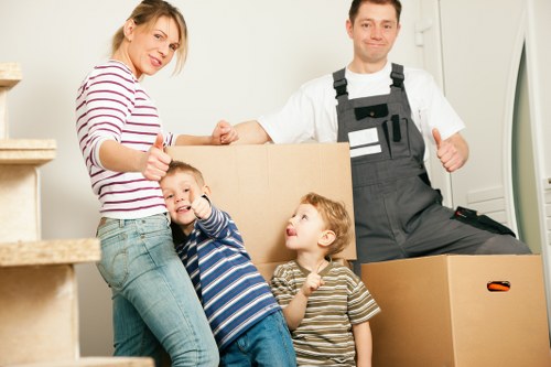 Local movers handling boxes and furniture for a Merton relocation