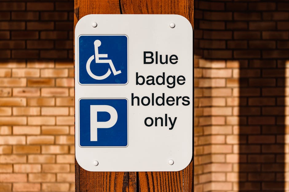 A rectangular metal sign attached to a stone wall with four screws at each corner, displaying the message 'PARKING WITH HOTEL PERMIT ONLY' in bold black letters. The wall is constructed of large, irre